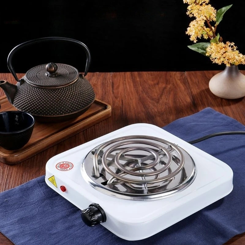 Plaque chauffante électrique simple et portable, idéale pour la cuisson rapide dans les petites cuisines ou en déplacement.