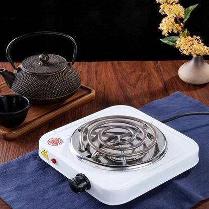 Plaque chauffante électrique simple et portable, idéale pour la cuisson rapide dans les petites cuisines ou en déplacement.